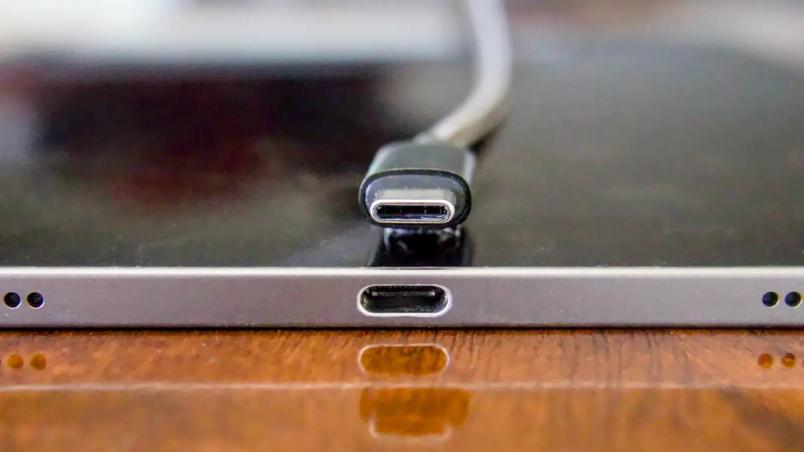 USB-C cable tip lined up with a USB-C port on a device